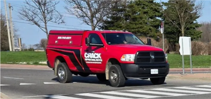 The Crack Specialists red vehicle